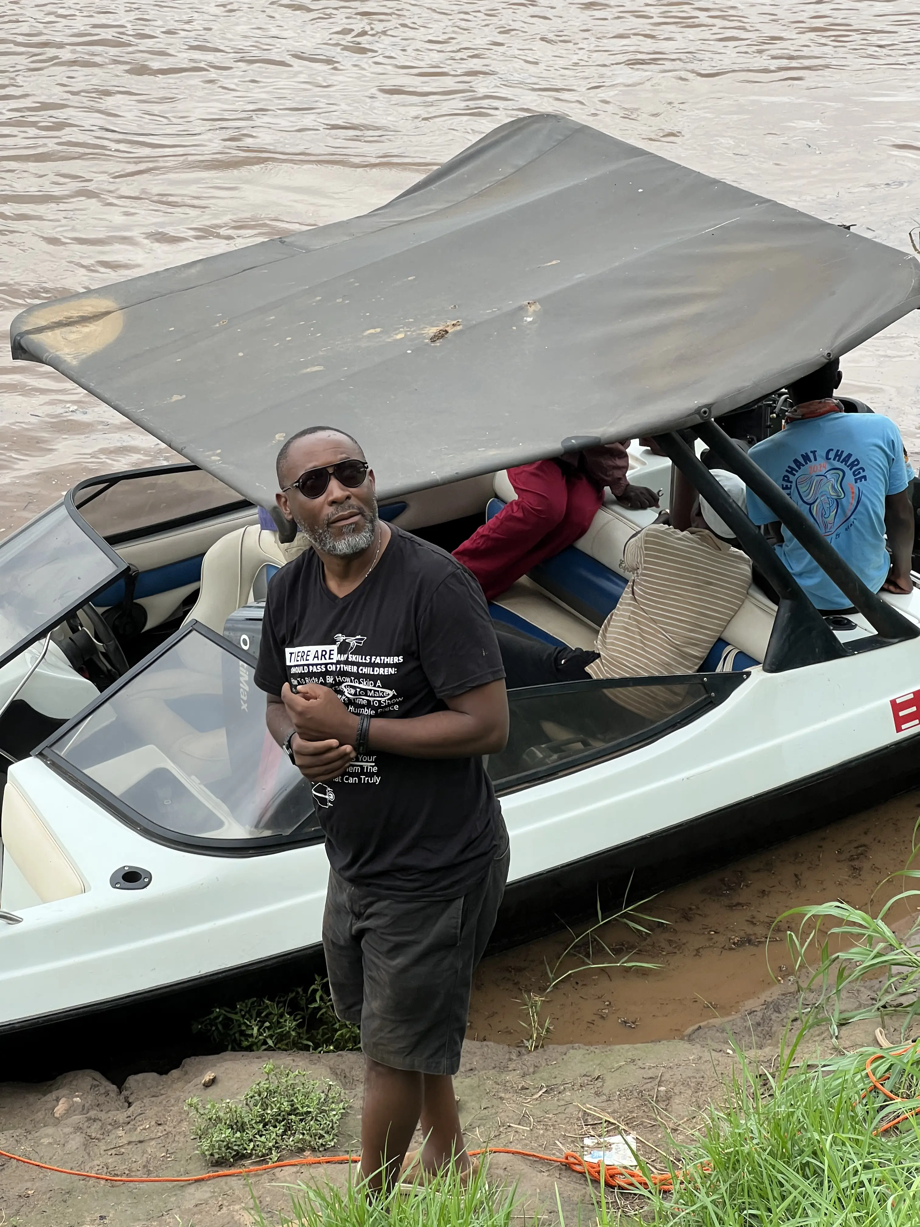 Luxury guests boarding a minimalist boat on the Zambezi river