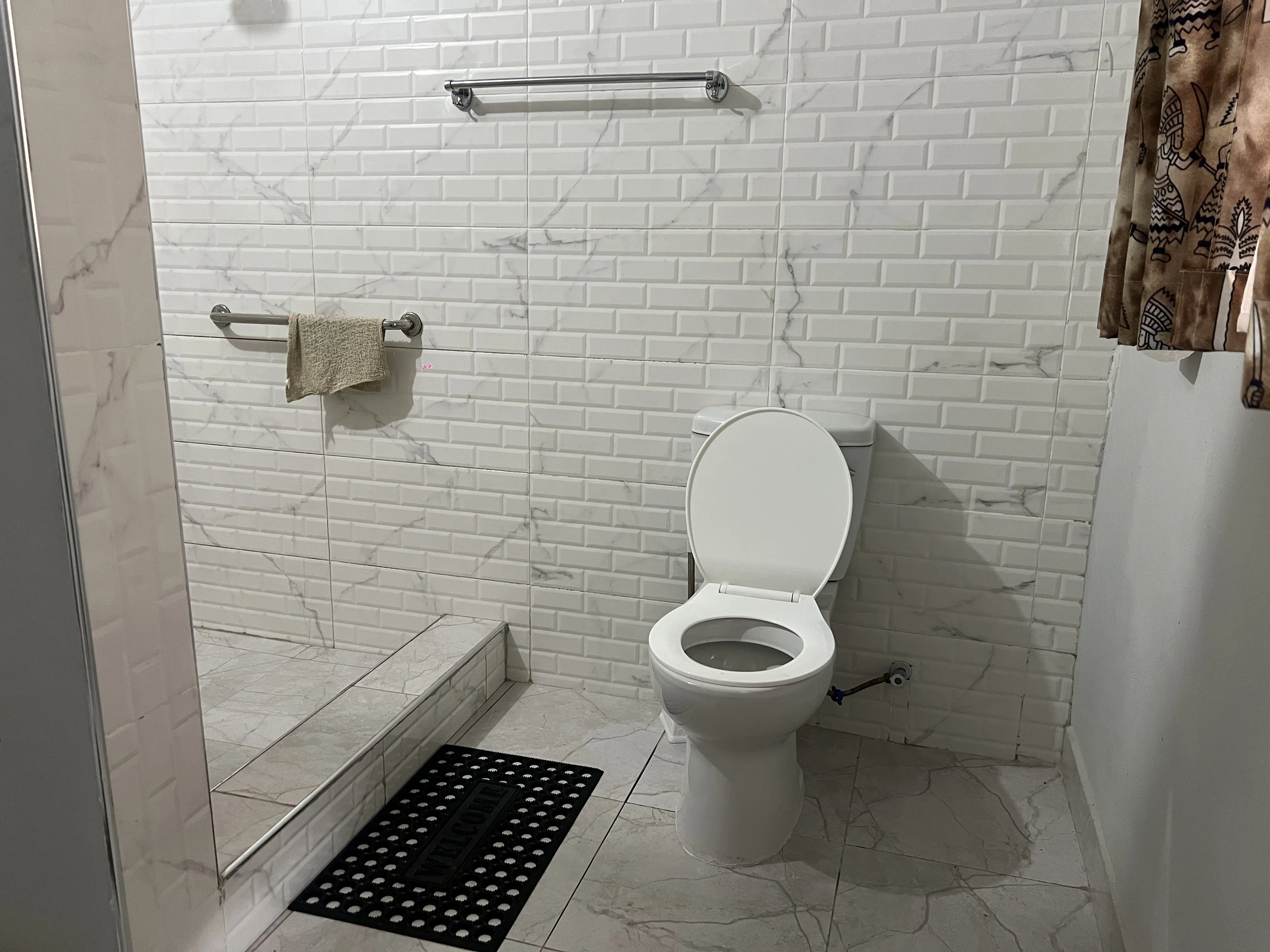 Clean minimalist ensuite bathroom concrete design